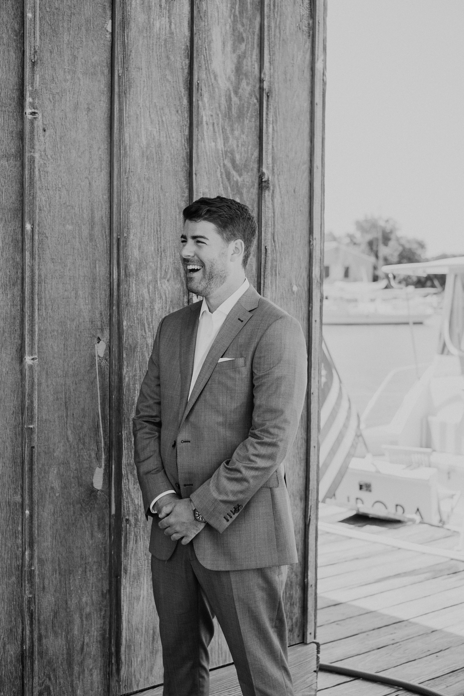 groom smiles big as he sees his bride during first look