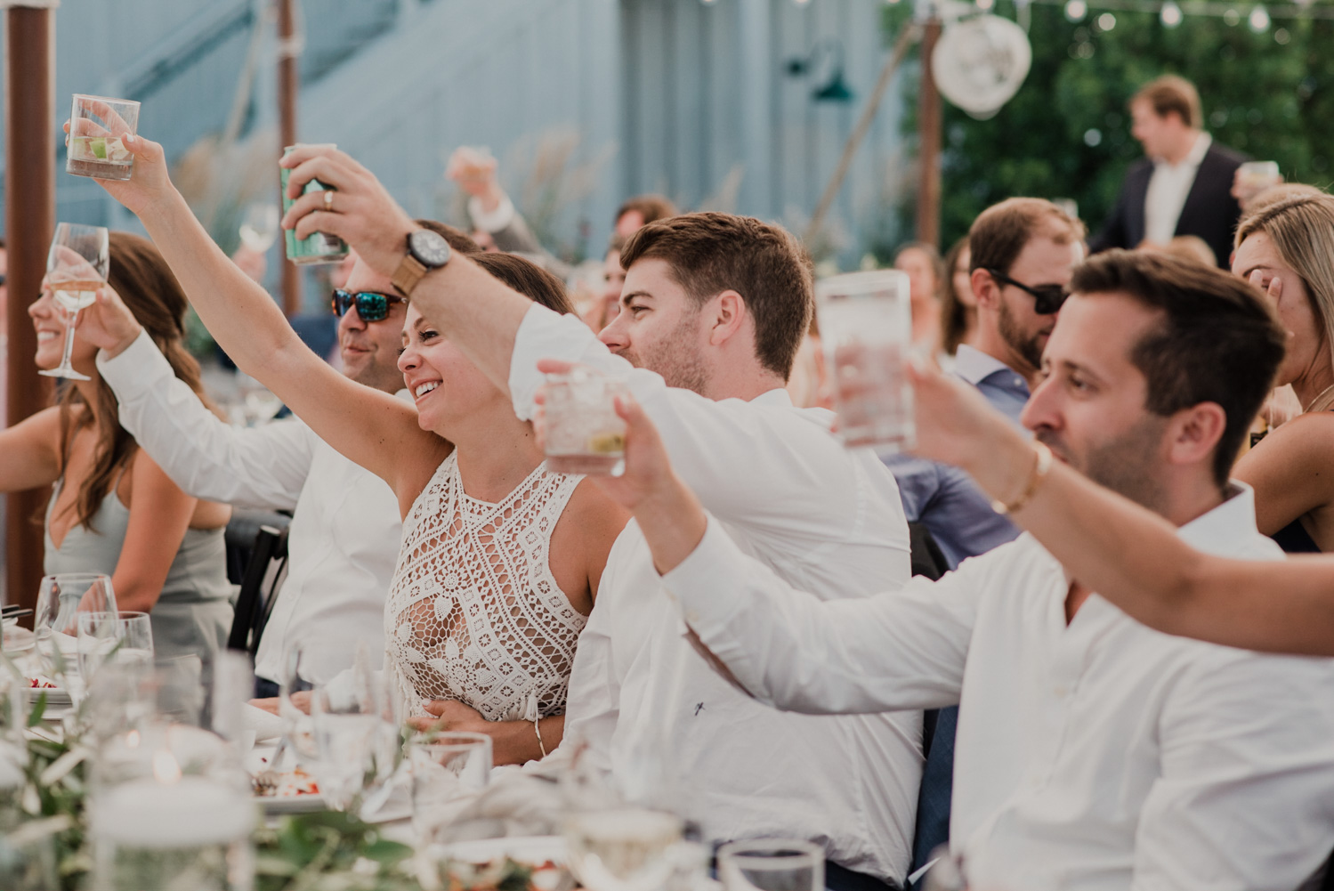 wedding guests cheers during toasts