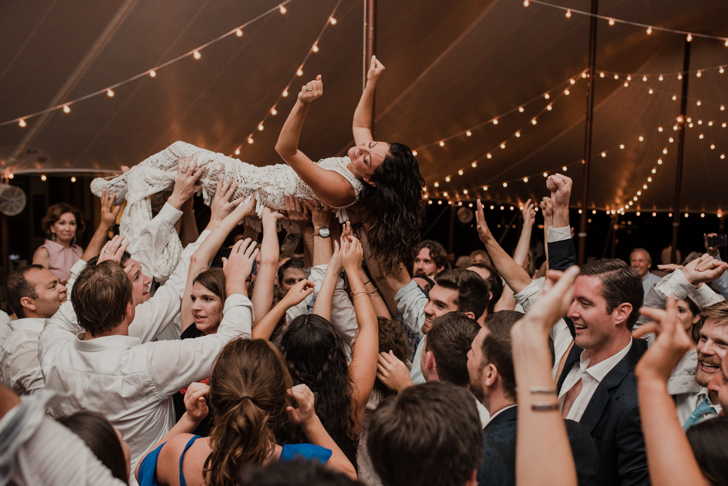 bride crowd surfs during reception at st michaels wedding