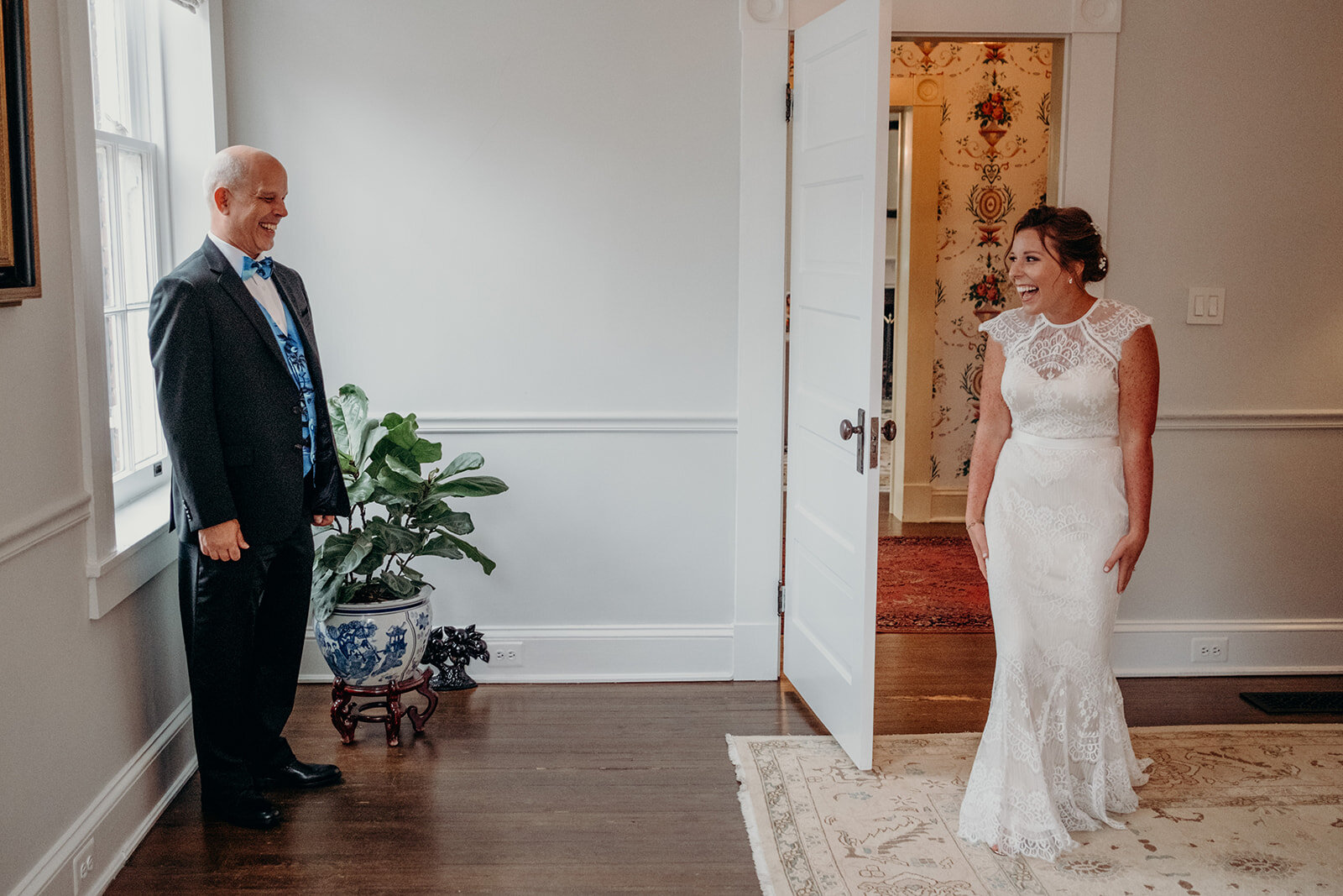 A bride shares a first look with her dad before her outdoor wedding ceremony at Birkby House in Leesburg, VA. 