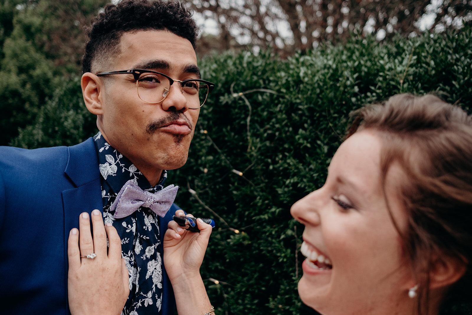 A groom shows off his half-shaved mustache during his first look with his bride at Birkby House in Leesburg, VA. 