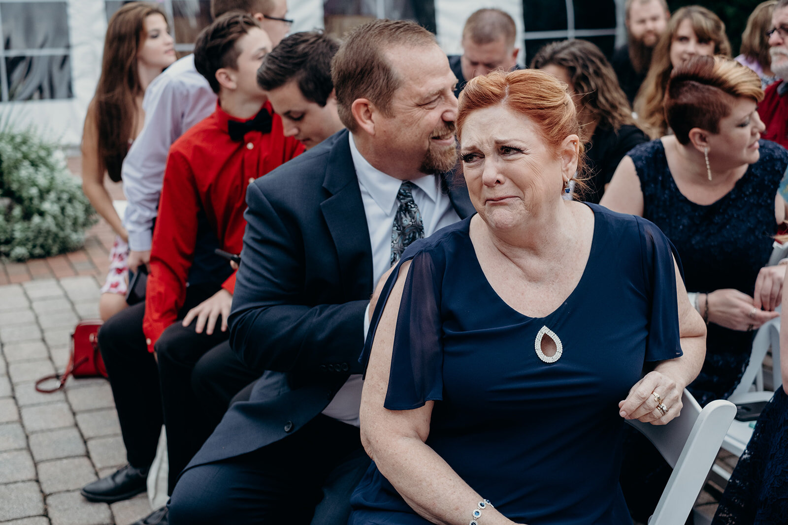 The mother of the groom gets teary eyed as she looks at her son standing ready to get married at the Birkby House in Leesburg, VA.