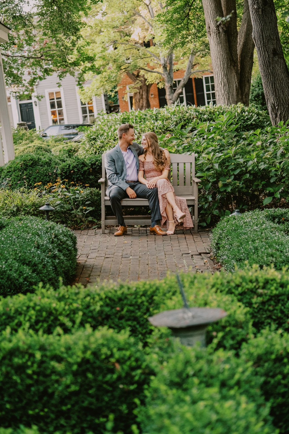 Old town alexandria couple sitting on a bench in a garden