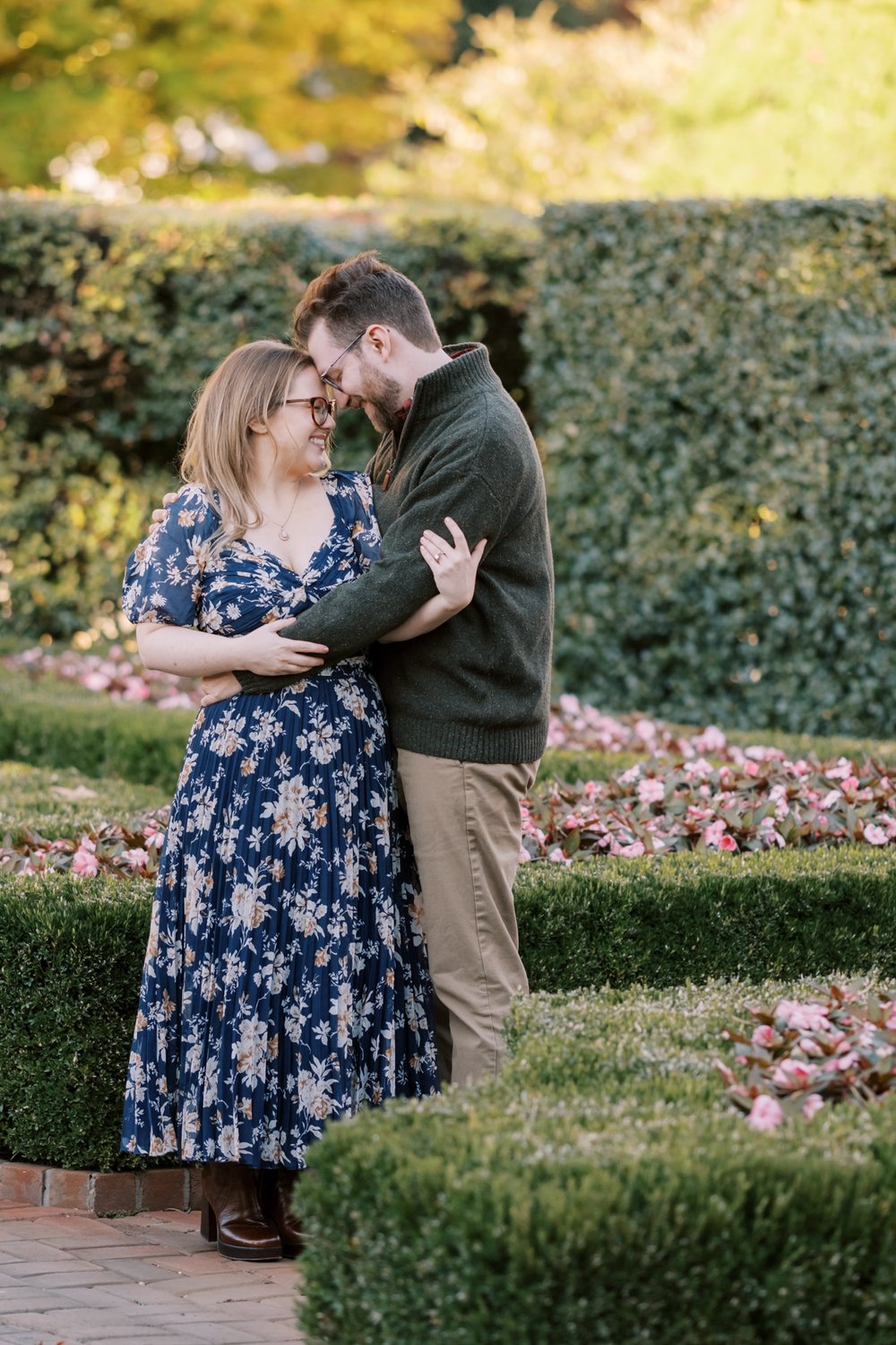 Engagement couple portrait in flowery gardens at the inn at little Washington.