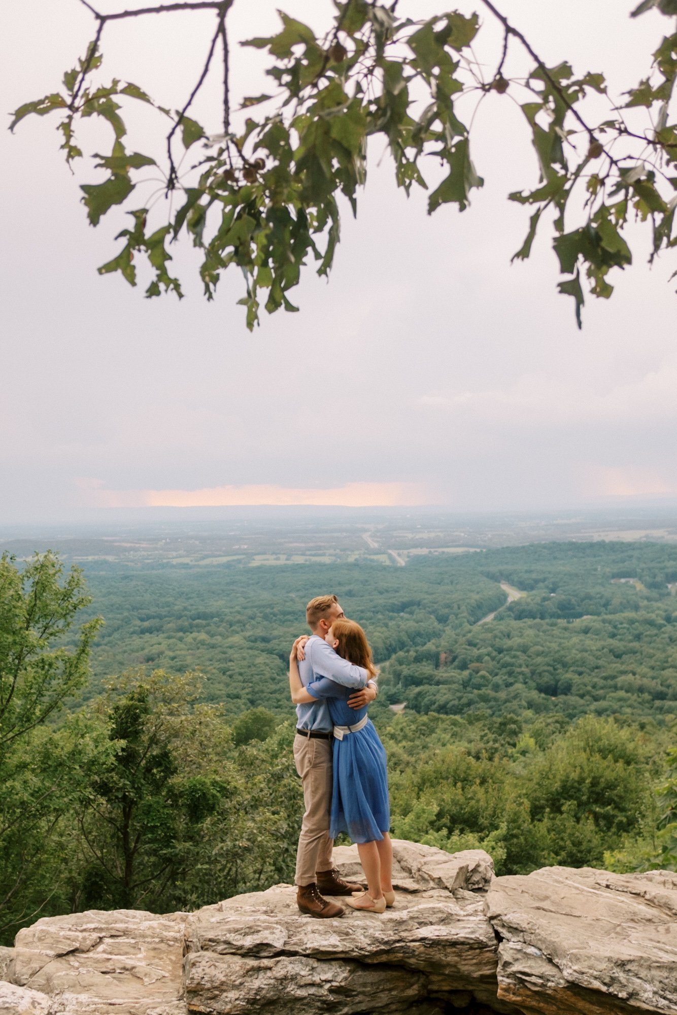 Couple embraces at bear's den overlook