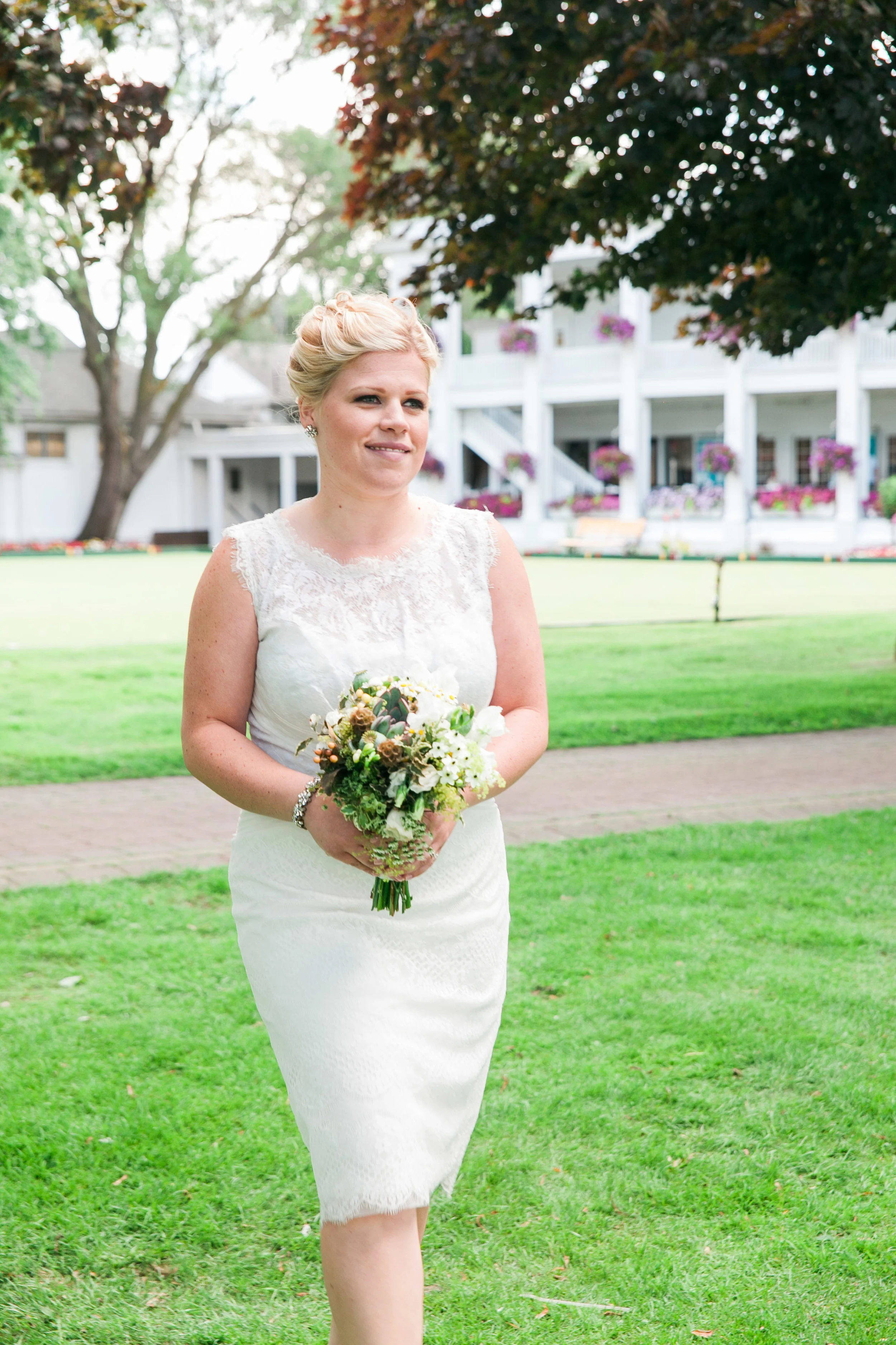 Bridesmaid walking down aisle at Yacht Club wedding