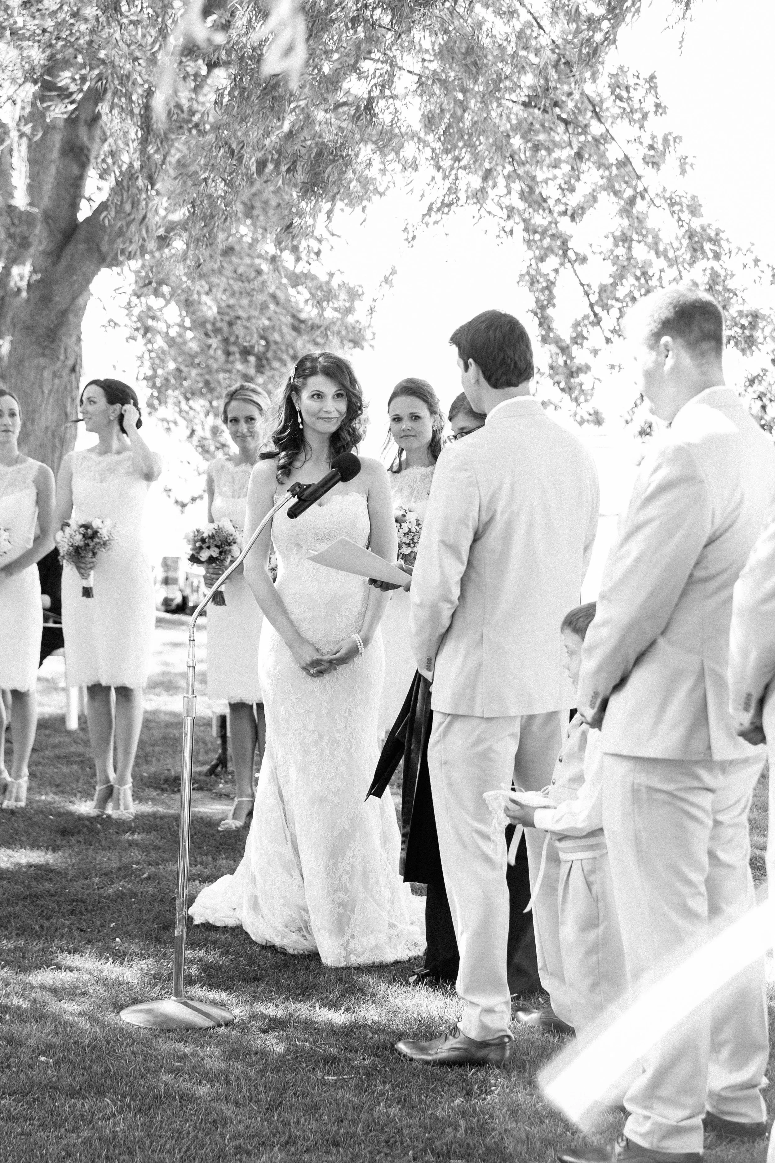 Groom saying vows to bride at outdoor summer wedding in Toronto