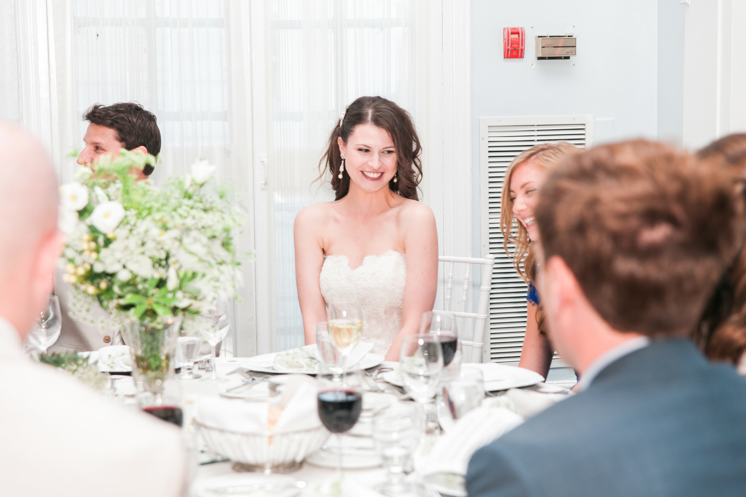 Bride laughing during wedding reception