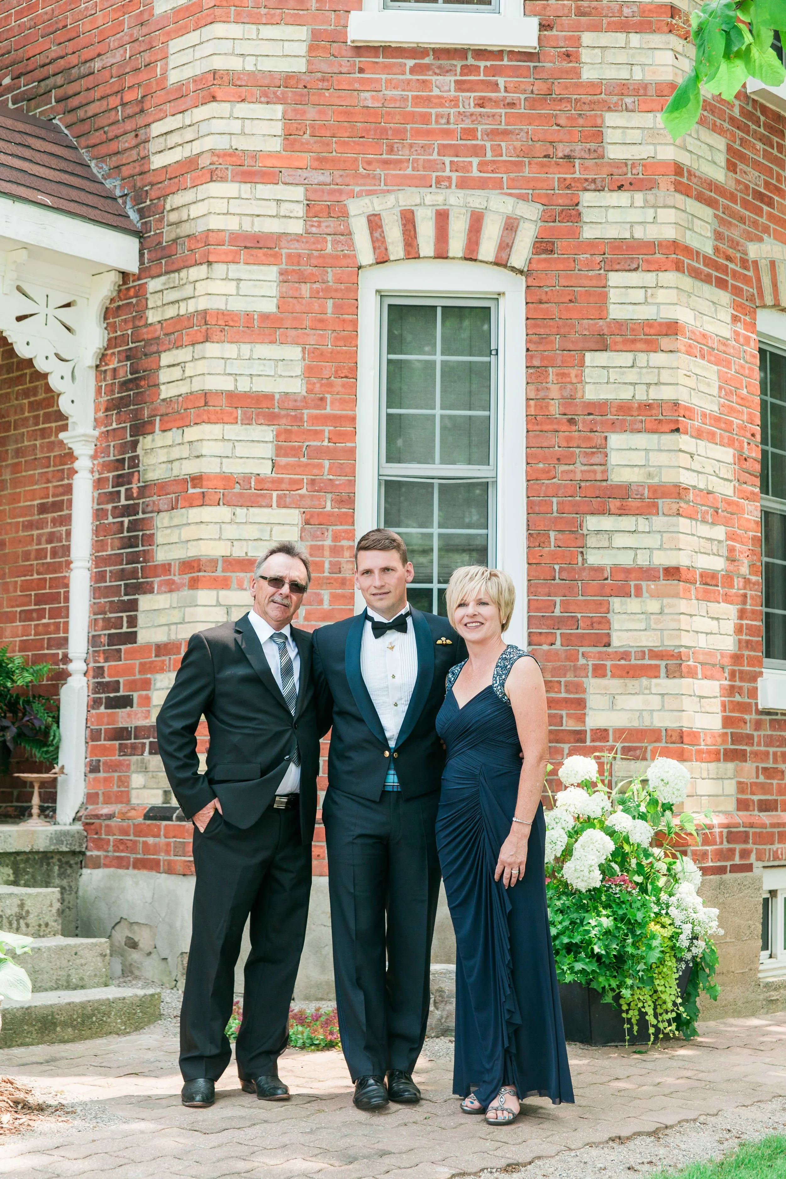 Groom's family portrait at wedding