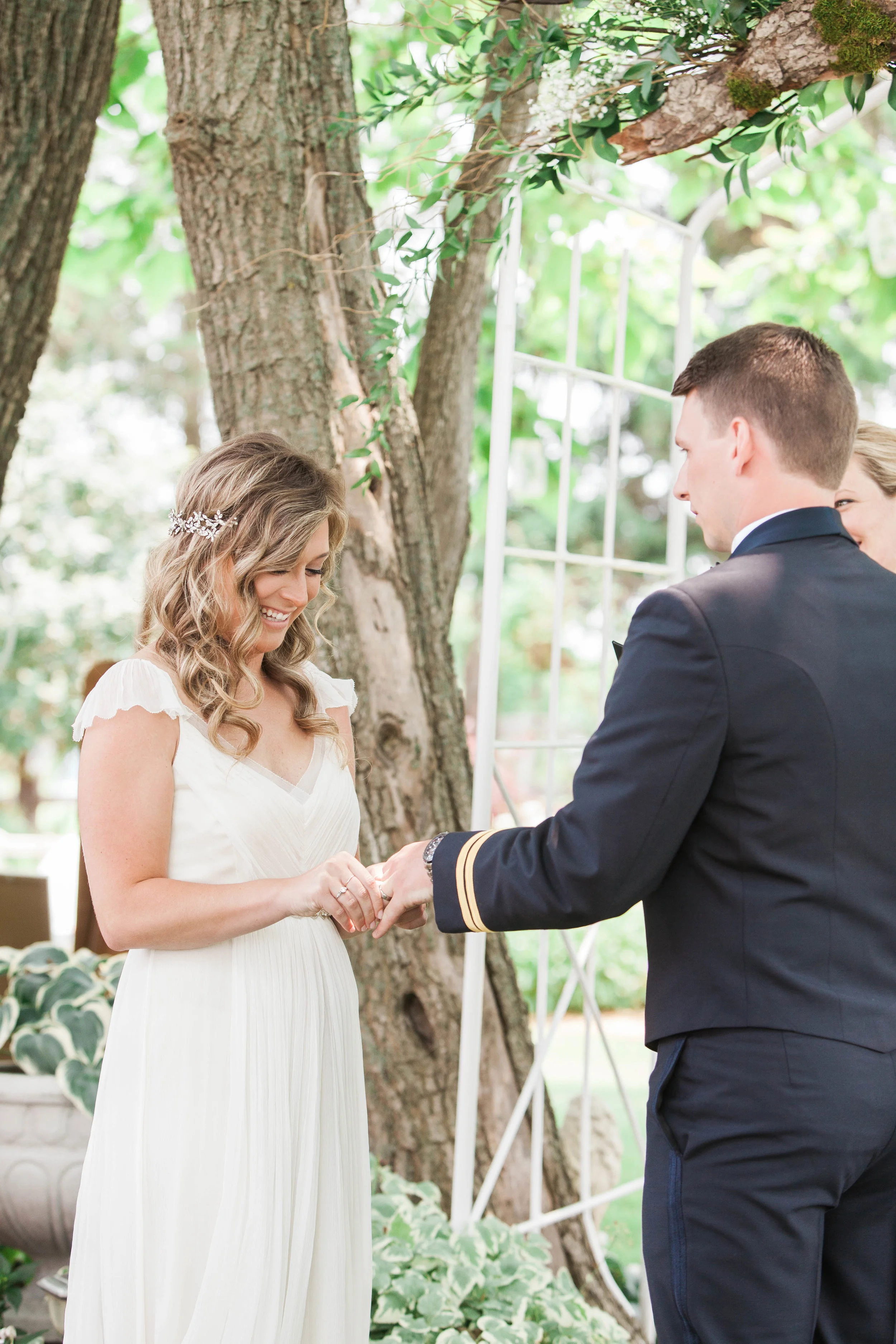 Bride and groom exchanging rings at intimate wedding