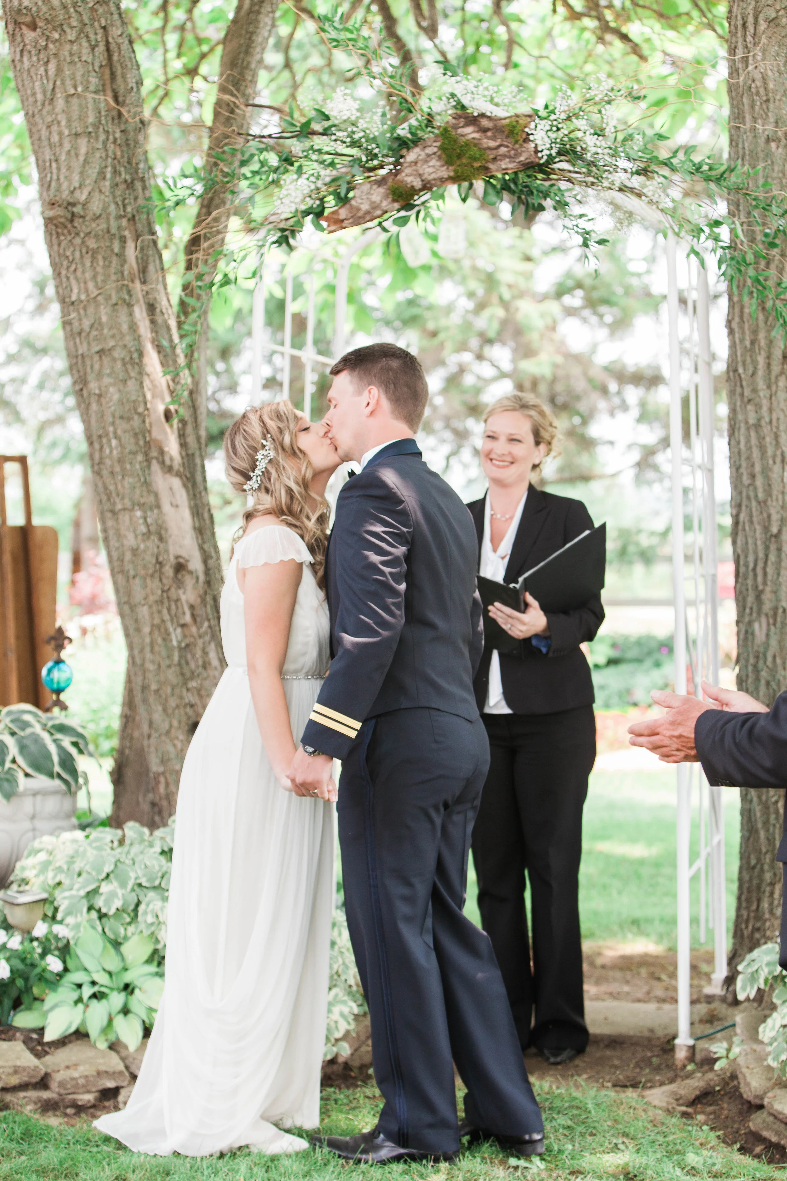 First kiss at intimate outdoor wedding