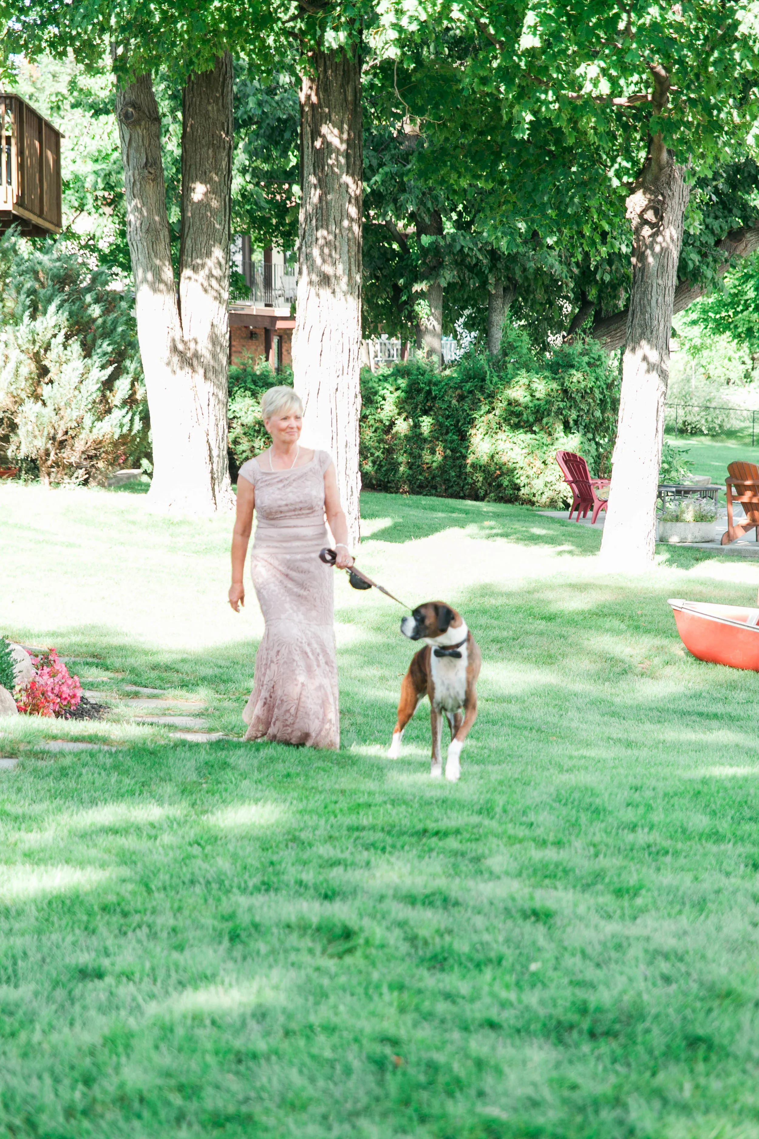 Mother of the bride and her dog walking down the aisle