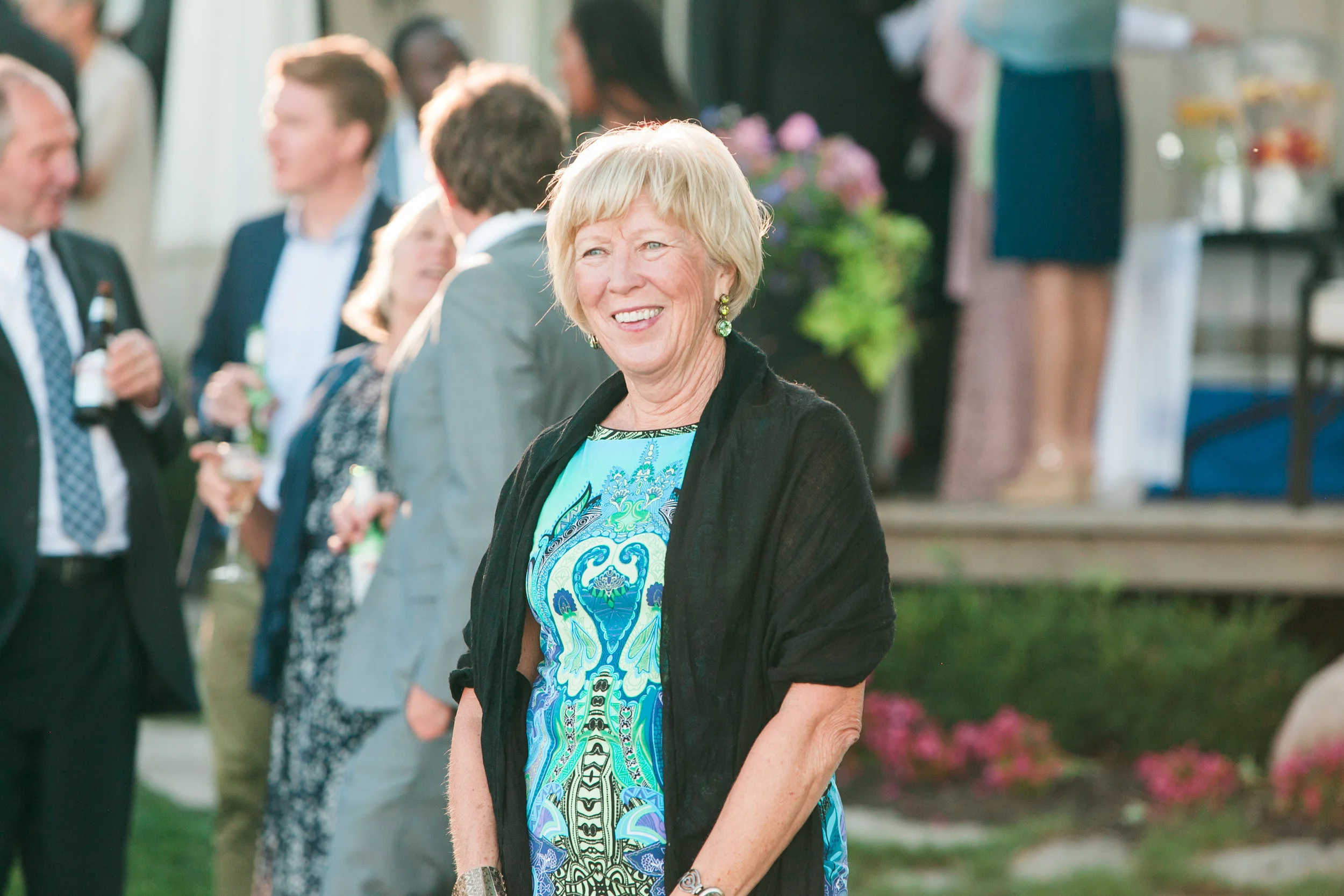 Wedding guest smiling during ceremony