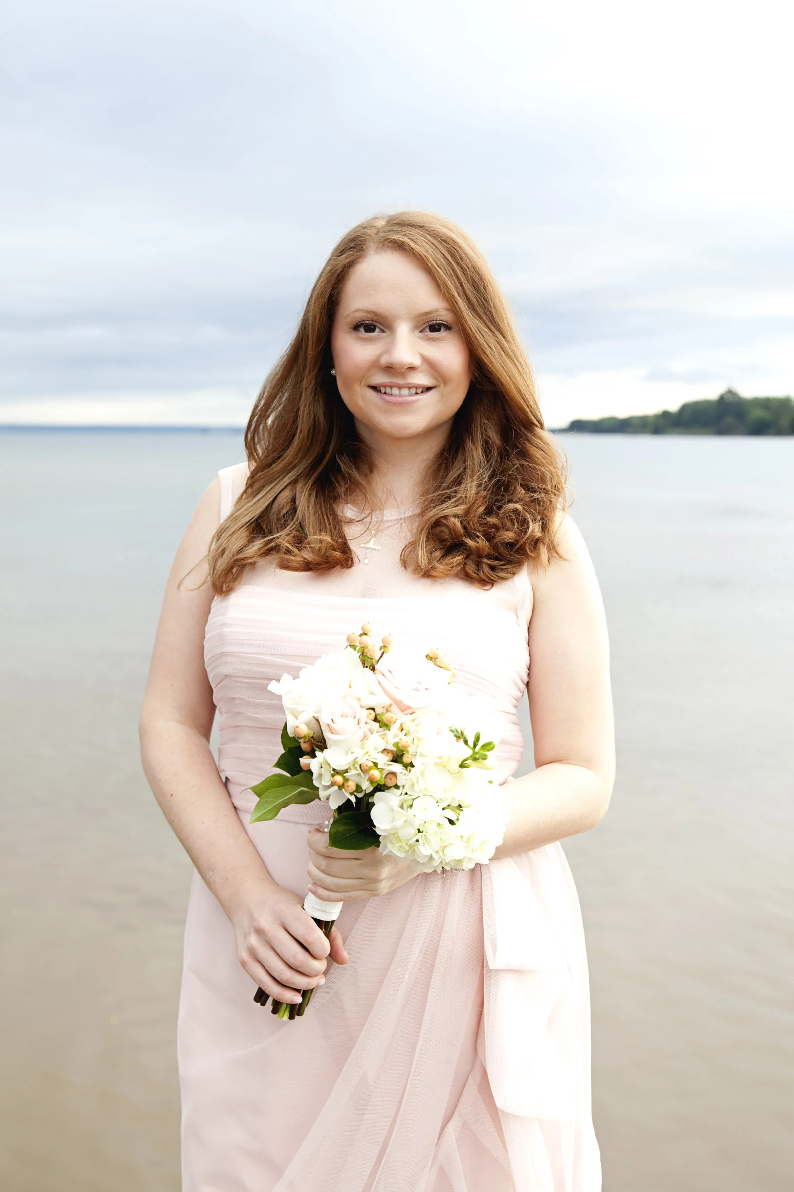 Bridesmaids in light pink dress for winter wedding