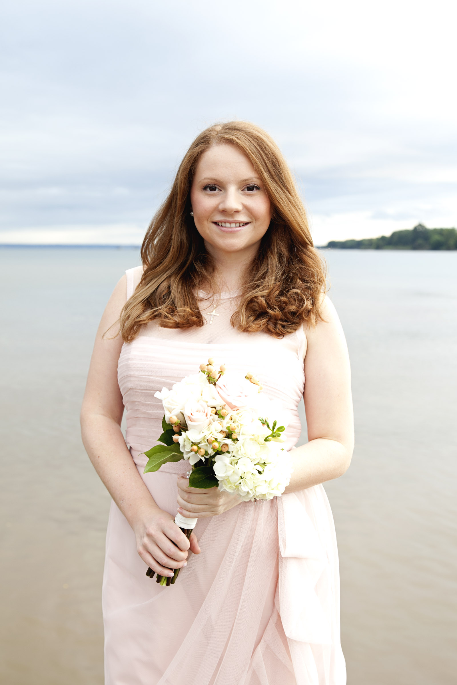 Bridesmaids in light pink dress for winter wedding