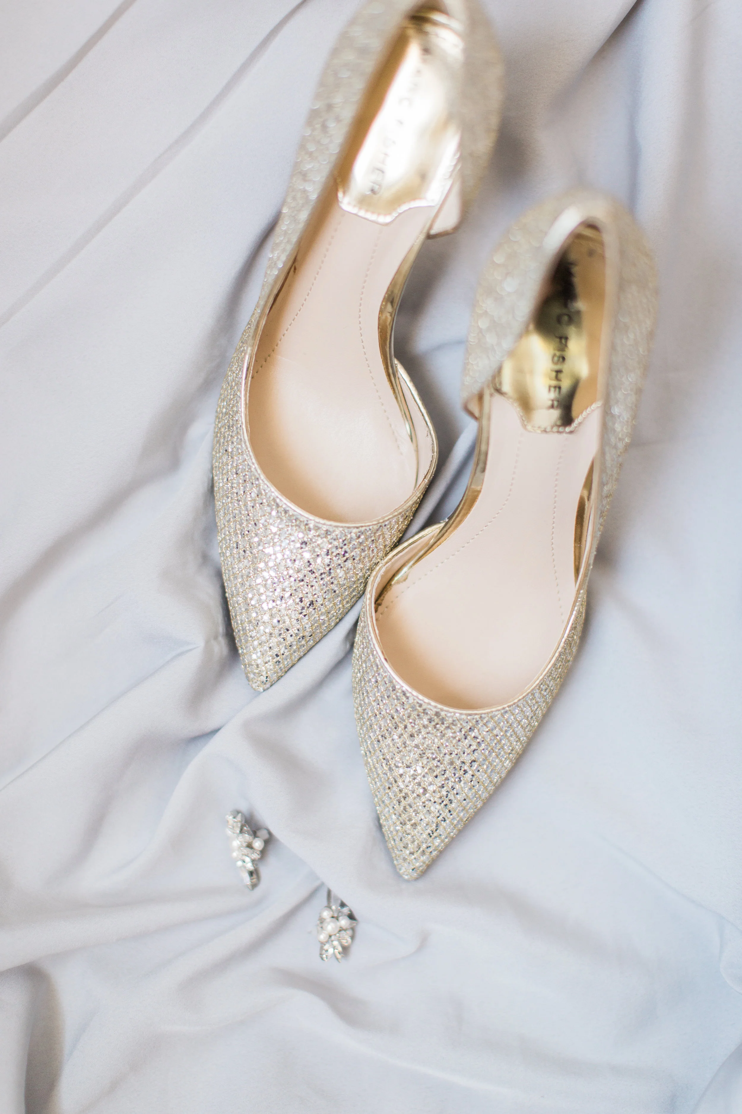 bride's wedding shoes and jewlery