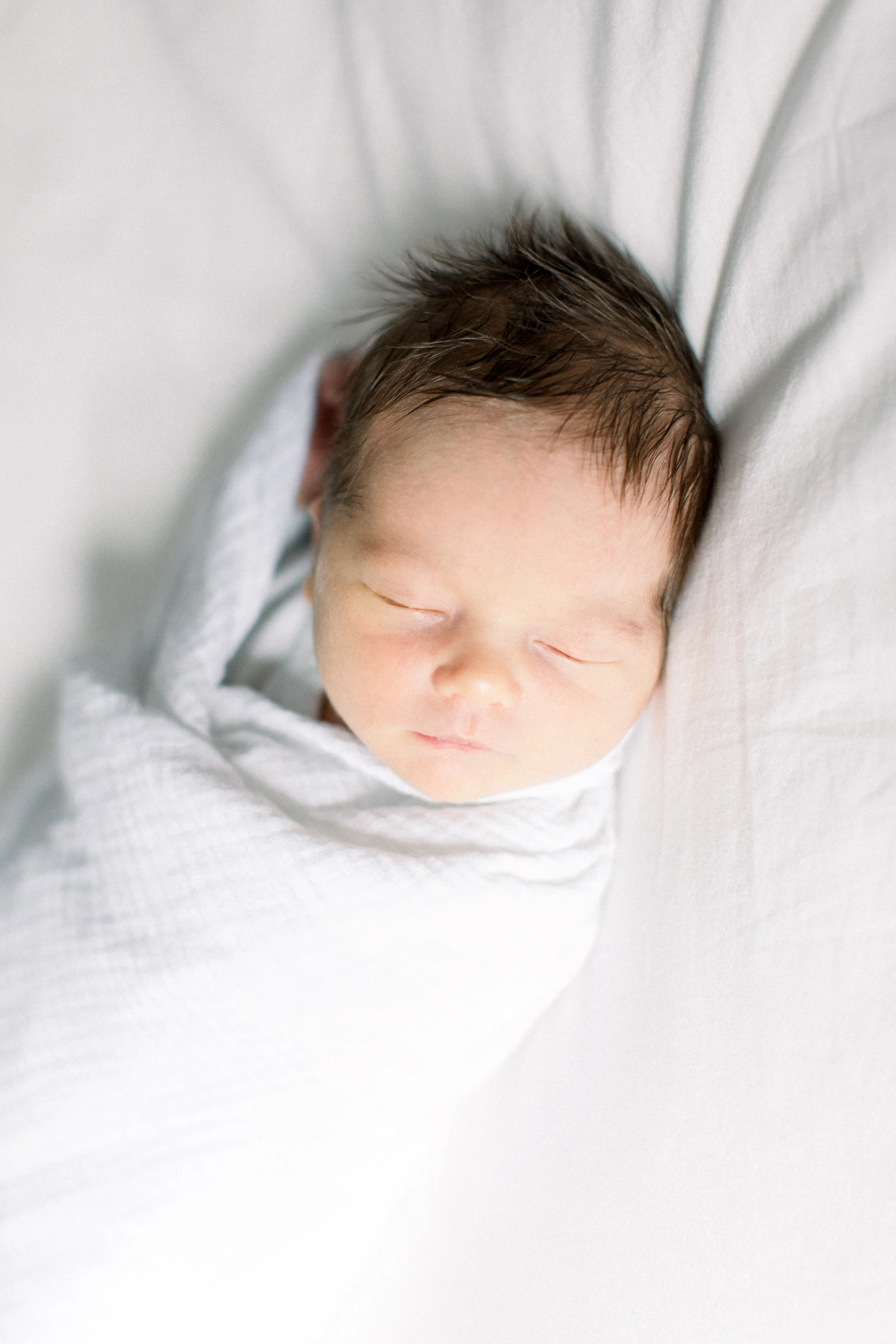 newborn baby swaddled.