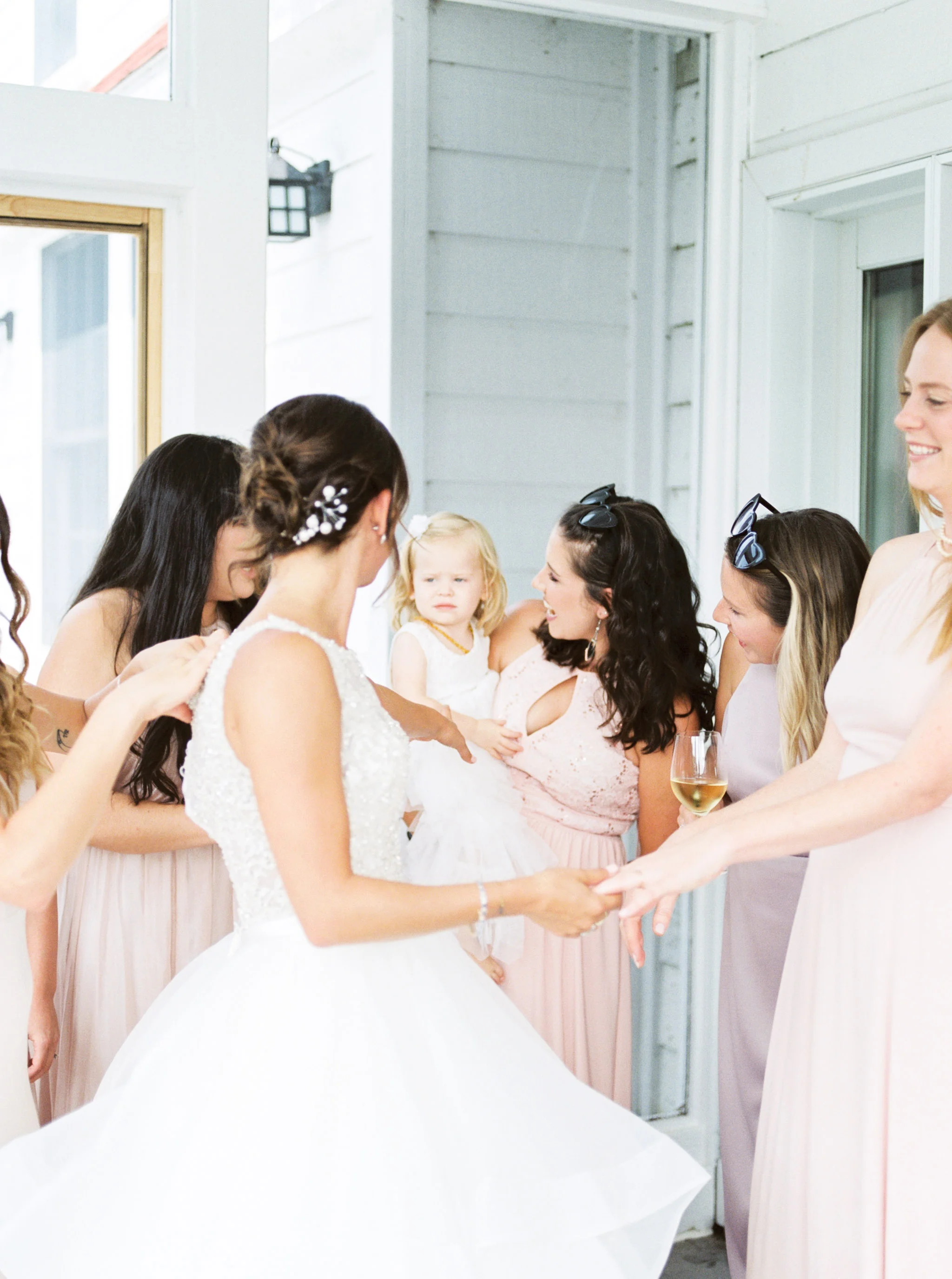 bridesmaids wearing pink dresses.