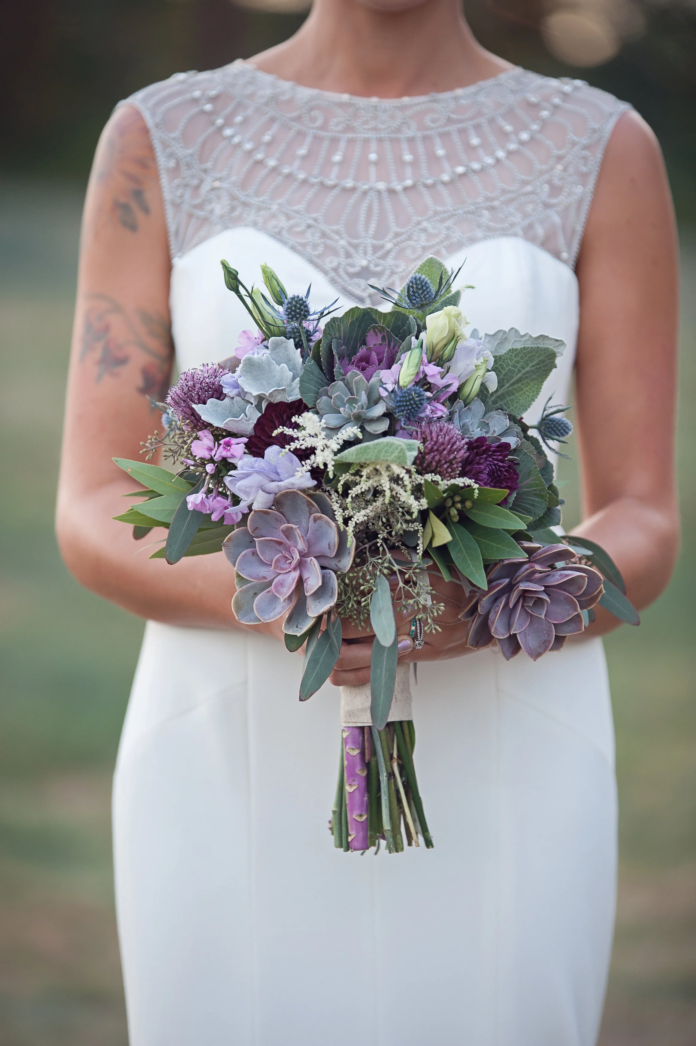 Oh don't we love this bouquet with succulents! Then we mixed in some Thistle, Kale, White Astilbe, Bullet Alliums and Bay leaf