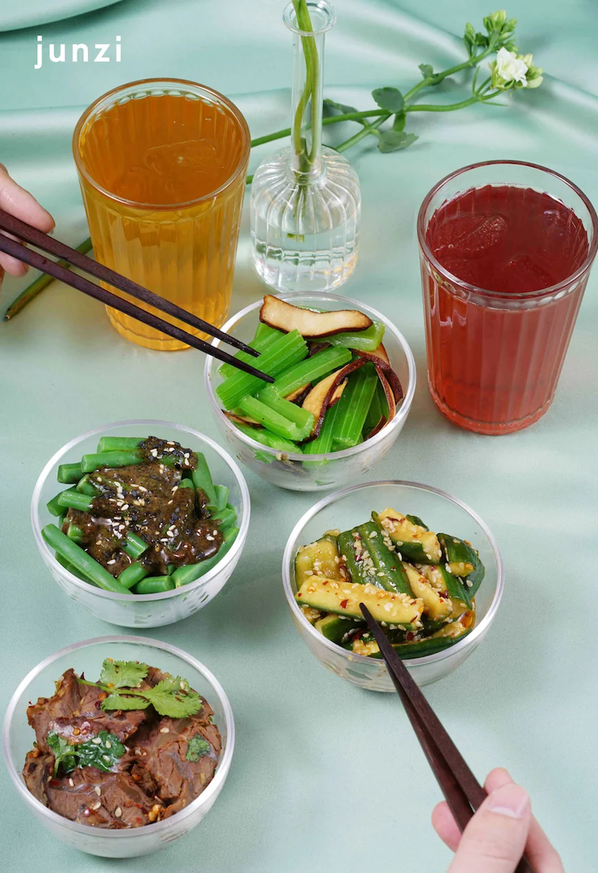 Four Seasons Appetizer Plate (Savory String Beans, Smoked Tofu & Celery, Smashed Cucumber, Spicy Beef Shank) and teas ©Junzi Kitchen 四季料理拼盘(蘸酱四季豆,香干芹菜,拍黄瓜,香辣牛腱肉)和特调茶饮 ©君子食堂