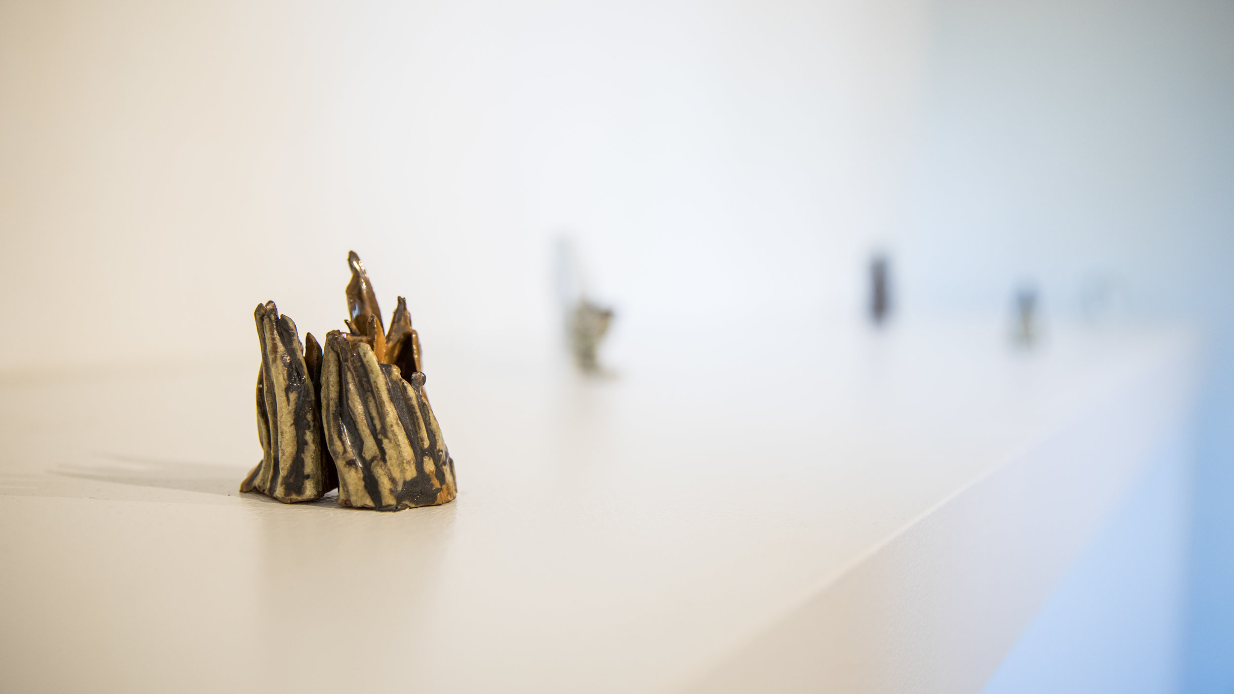Hilda Shen, Range of Mountains, 2014-2019. Glazed clay, a group of six, each around 2.75 x 2 x 2.25 inches, ©Hilda Shen, courtesy of Fou Gallery