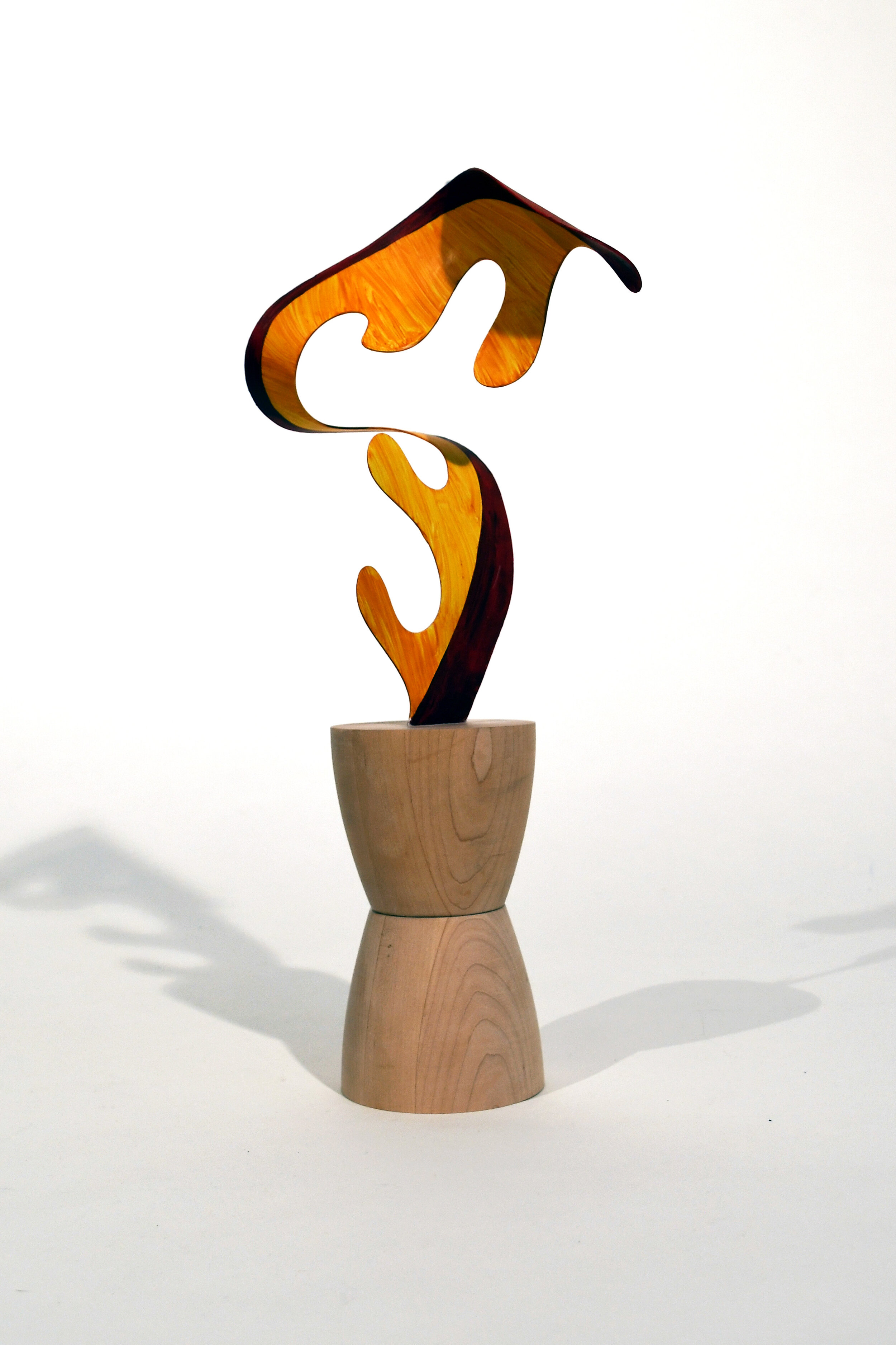  Wendy Letven , Flame,  2020. Painted Aluminum with on Maple Base, 18 x 8 x 5 inches 