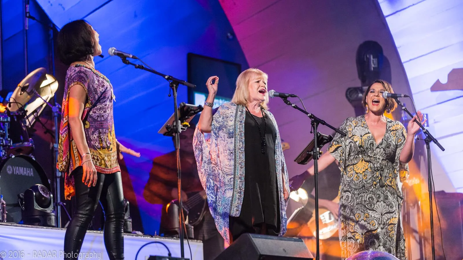 New Year's Eve at the SoundShell, Napier. Photo by RADAR Photography. ... The Lady Killers (Tina Cross, Suzanne Lynch and Jackie Clarke) and their band (Brett Adams on guitar, Grant Winterburn on keyboards, Junior Turua on bass and Stephen Thomas on drums) supported by Olivia Karlsson Music