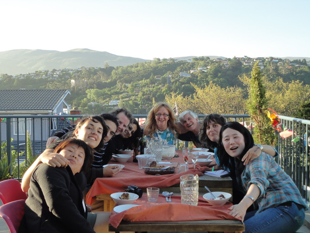 Students and WWOOFers enjoying a lovely summer meal outside