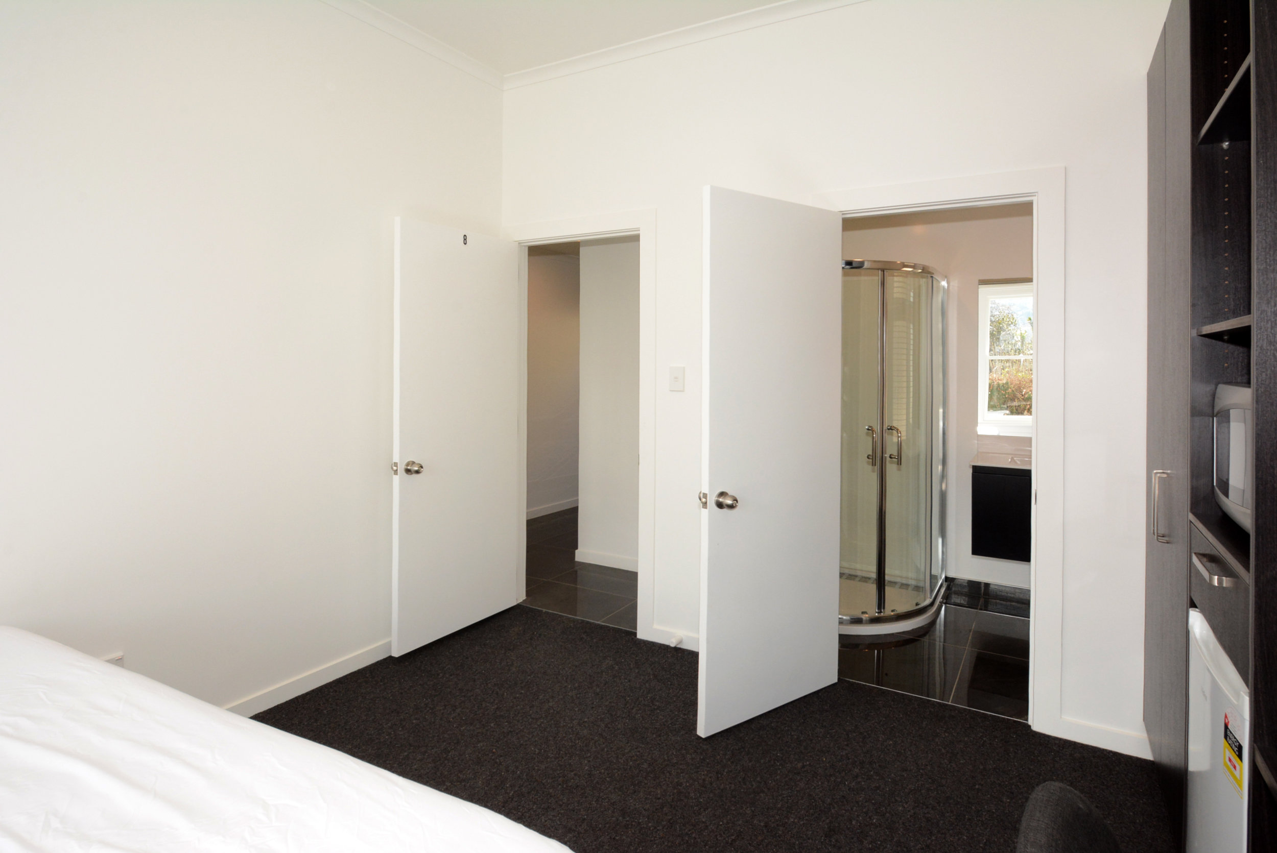 Execution Studio room entrance and ensuite bathroom