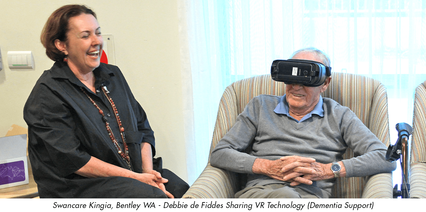 Debbie de Fiddes  at Swancare Aged Care Facility. With a Resident using New Technology. VR Goggles Headset in Perth
