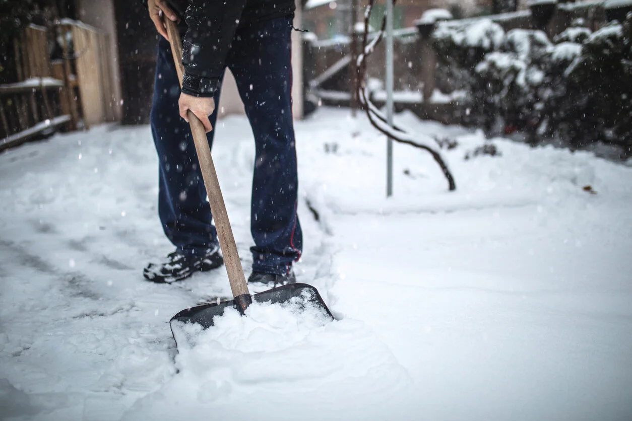 Close-up-of-a-man-clening-his-driveway-after-a-heavy-snowfall-1094226064_1258x838.jpeg