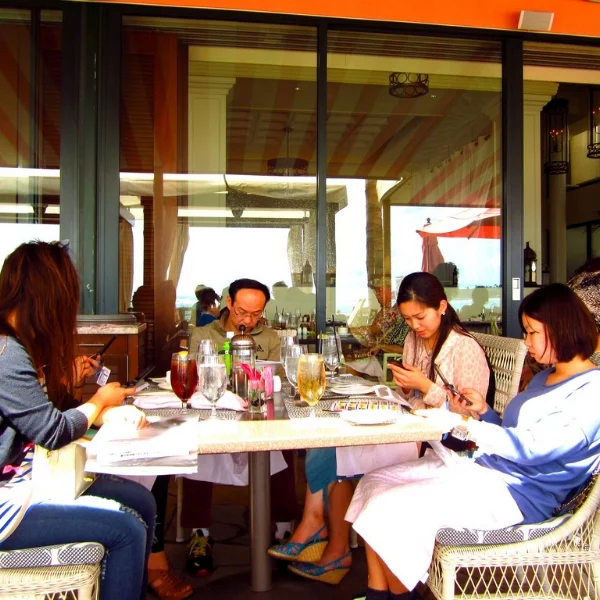 If someone at this table lit their napkin on fire would the others notice? Depends. Can they put it on Snapchat?