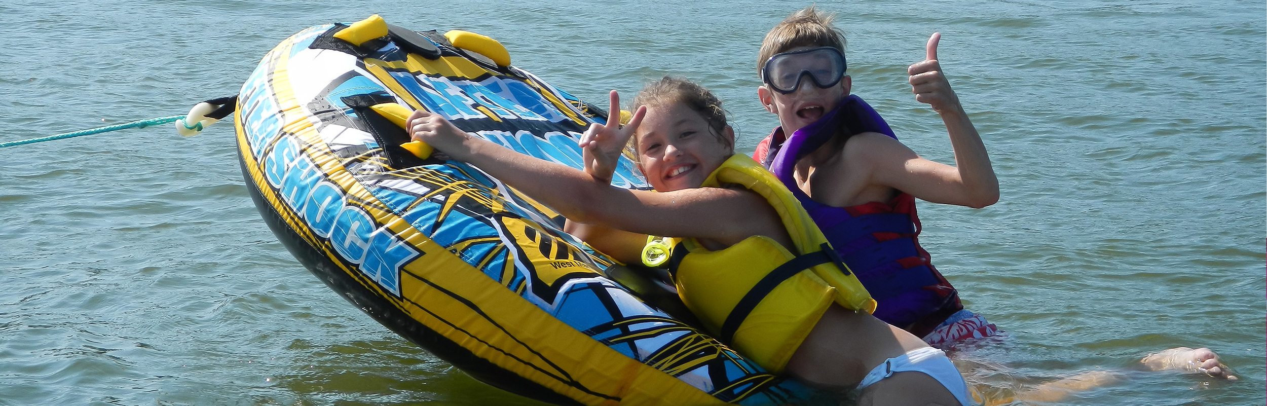 kids rafting in water