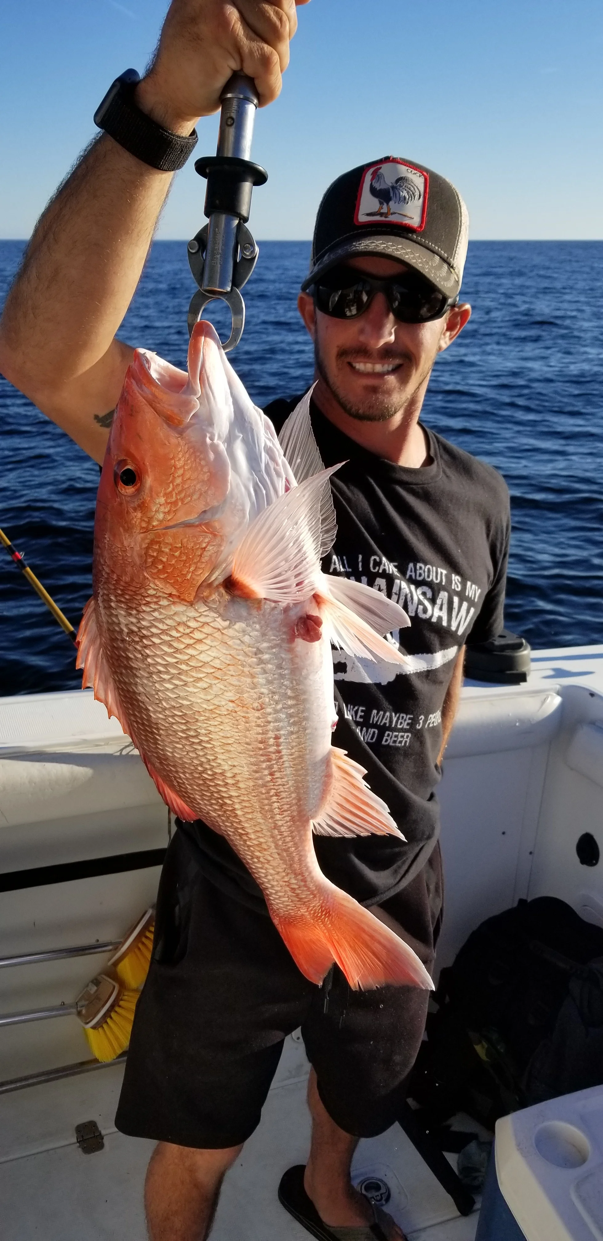 Man holding red snapper catch