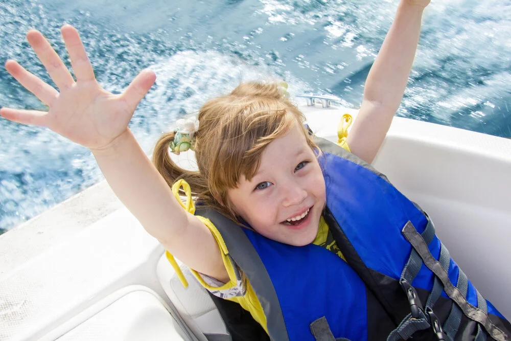 child wearing a life jacket