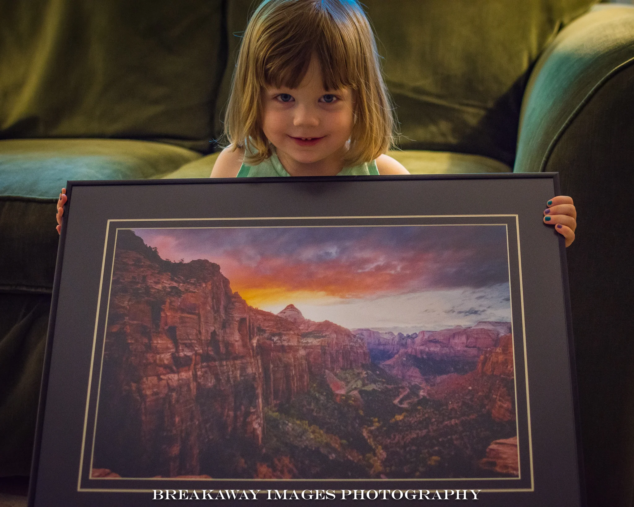 Emma holding "Sunset over Zion National Park