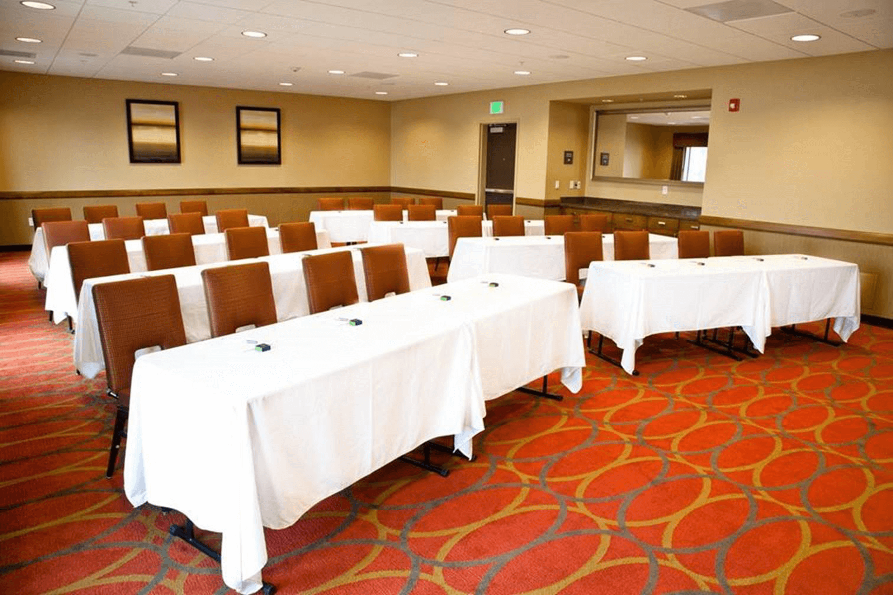  Hampton Inn and Suites Salinas meeting room interior with linen covered banquet tables 