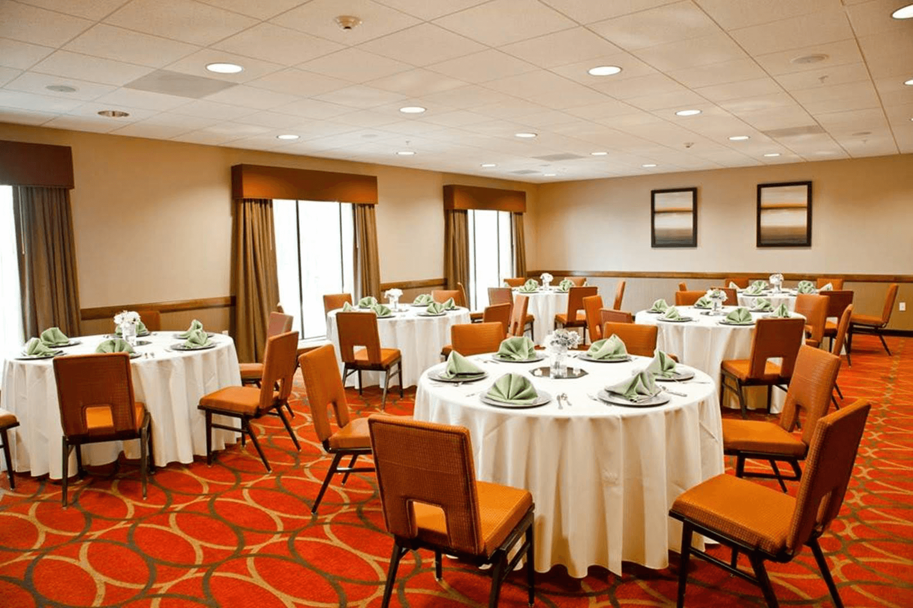 Hampton Inn and Suites Salinas interior meeting room with set round tables 
