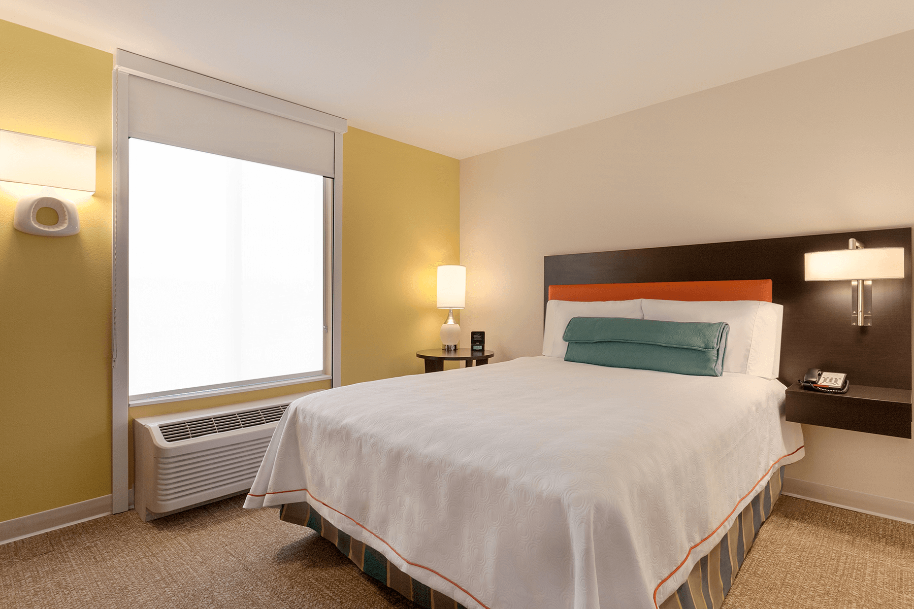  Home 2 Suites suite interior with queen bed 