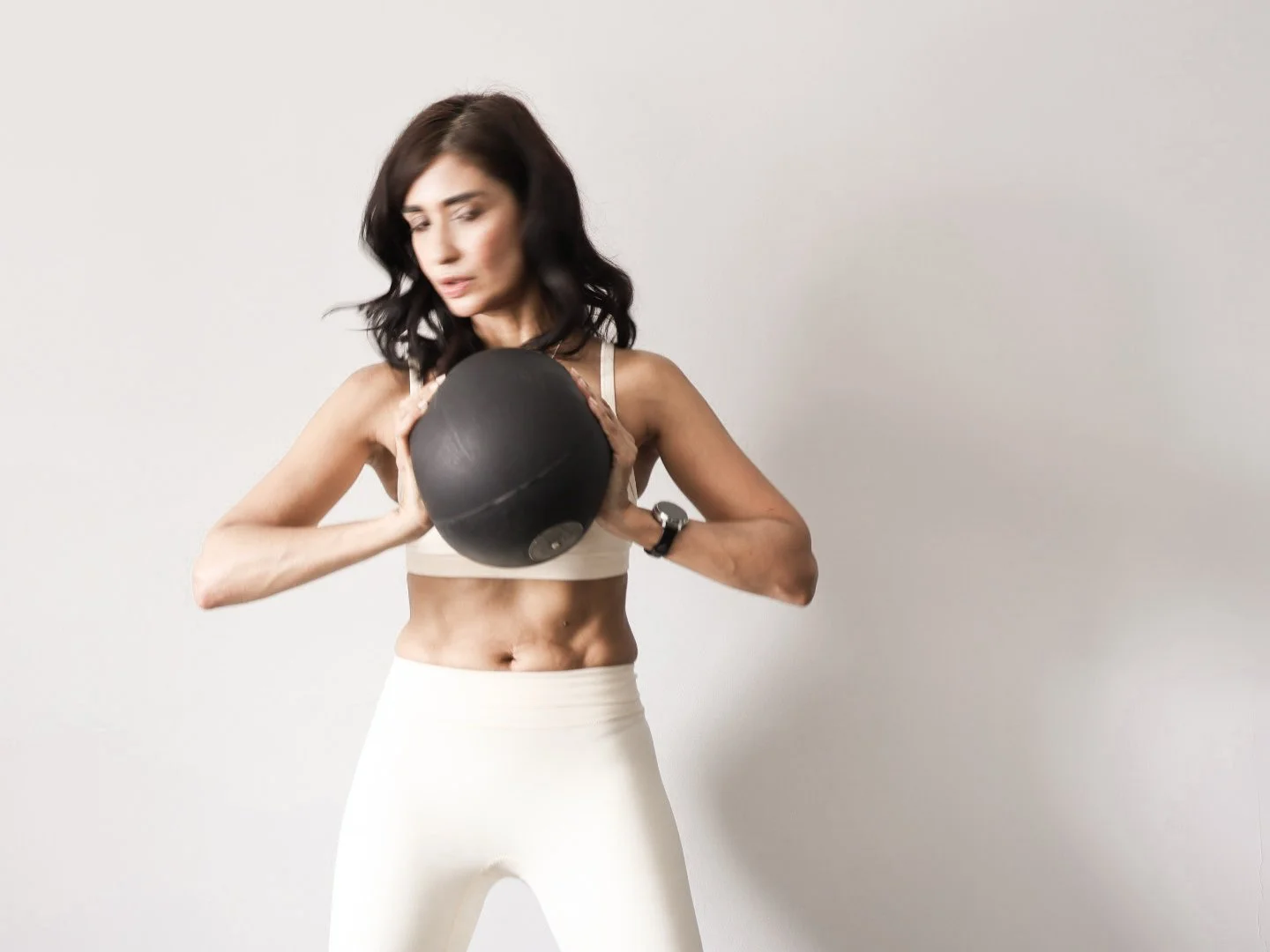 Saudia Baksh, Certified Pilates Instructor and Nutrition Coach, performing Pilates  exercises