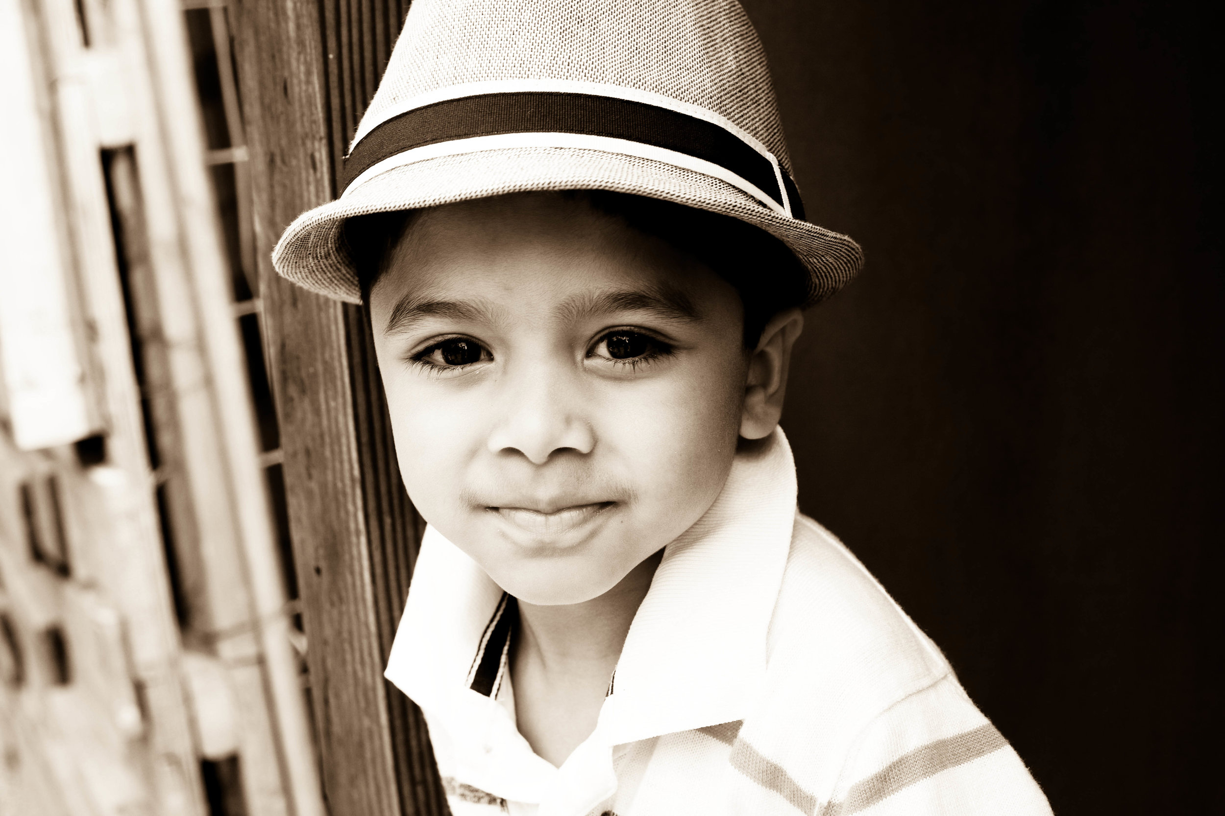 little boy wearing hat