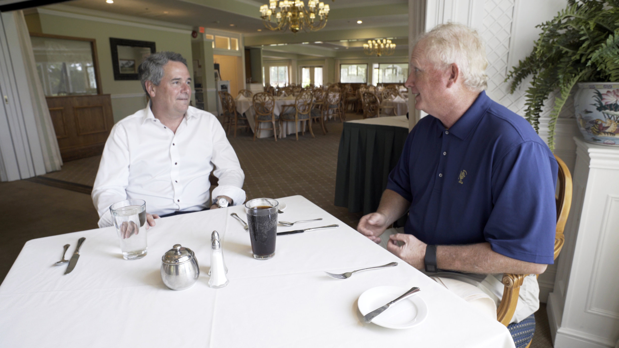 Kevin meeting with a client over lunch.