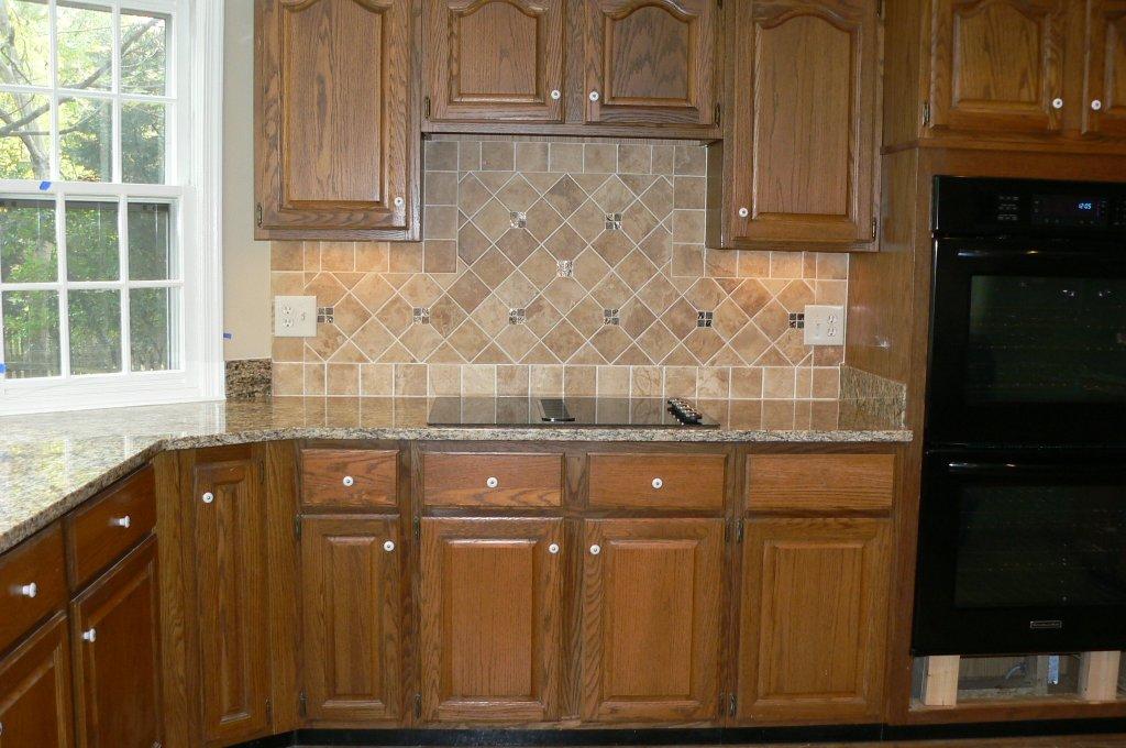 Before Cabinets with New Countertop/Backsplash Tile