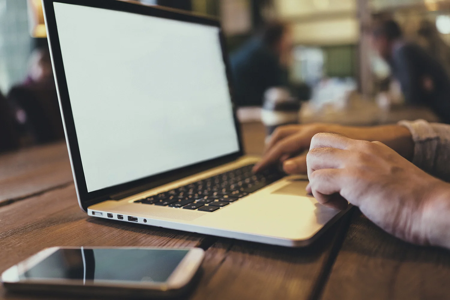 Man-using-laptop-in--cafe-000078318505_Fullx1500.jpg