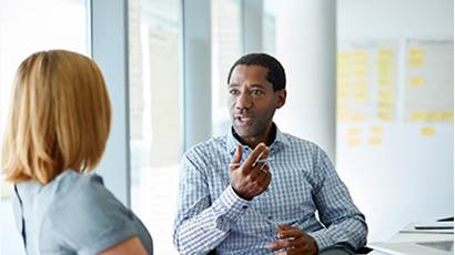 man talking in meeting.jpg