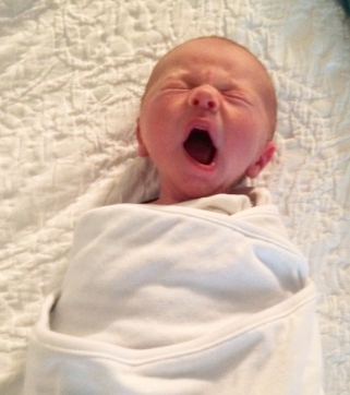 our teeny tiny swaddled helpless babe when he was just a few days old