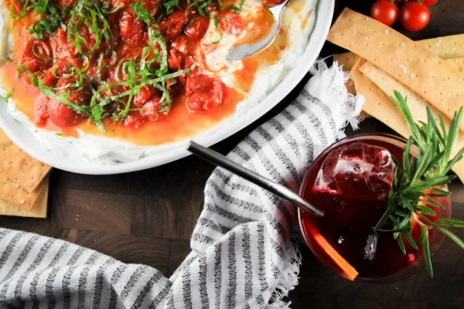 Blistered Tomatoes with Goat Cheese and a Cranberry Ginger Spritz