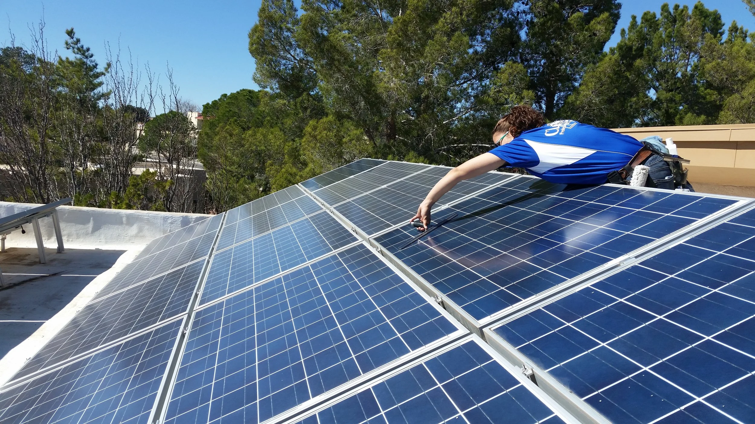 ruth cleaning solar panel.jpg