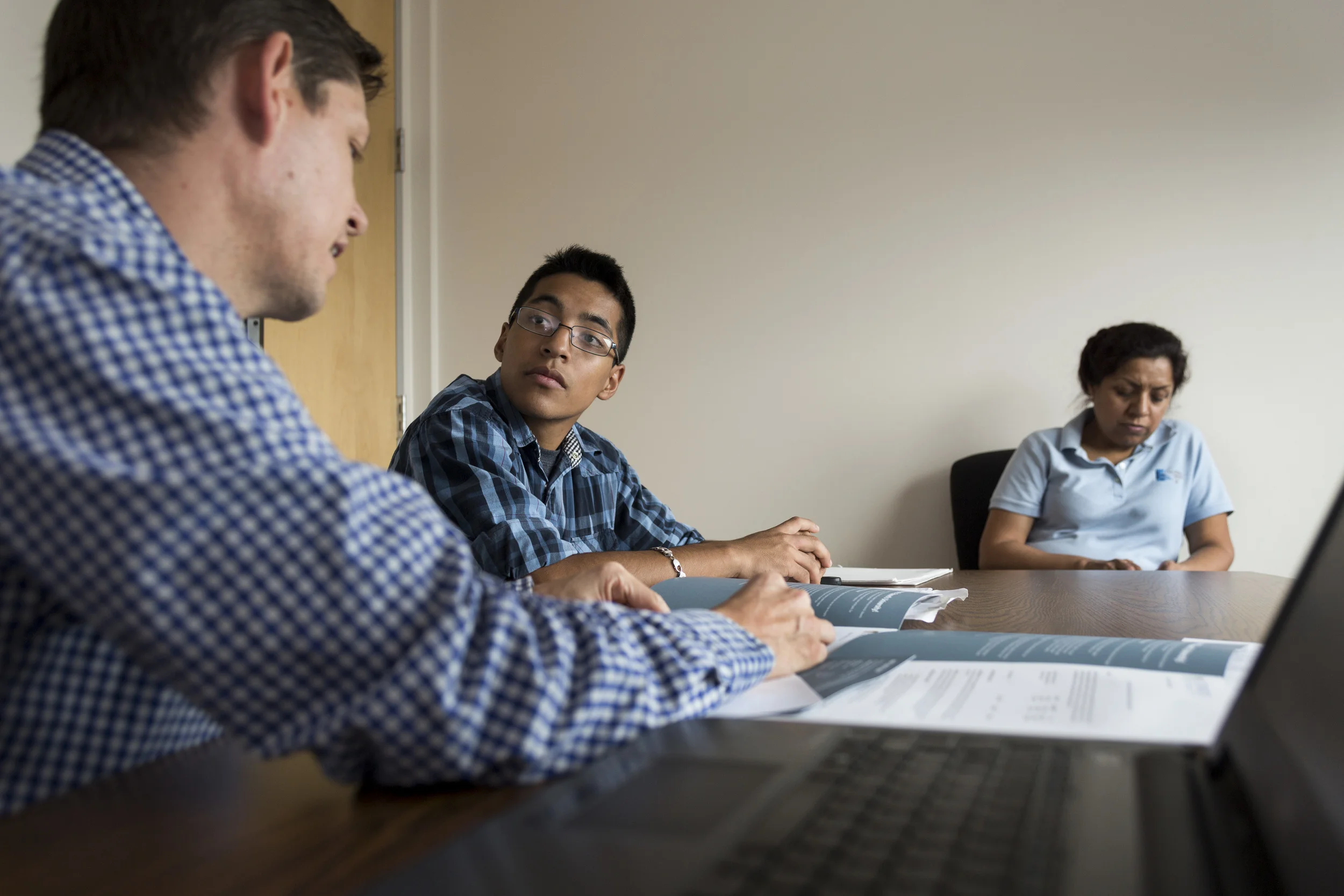 AUSTIN, TEXAS - July 8, 2015: Joseph Ramirez meets with Daniel Jackson at the Breakthrough Austin office. Ramirez is attempting to enroll at St. Edwards University for the fall semester. Miguel Gutierrez Jr./KUT News.