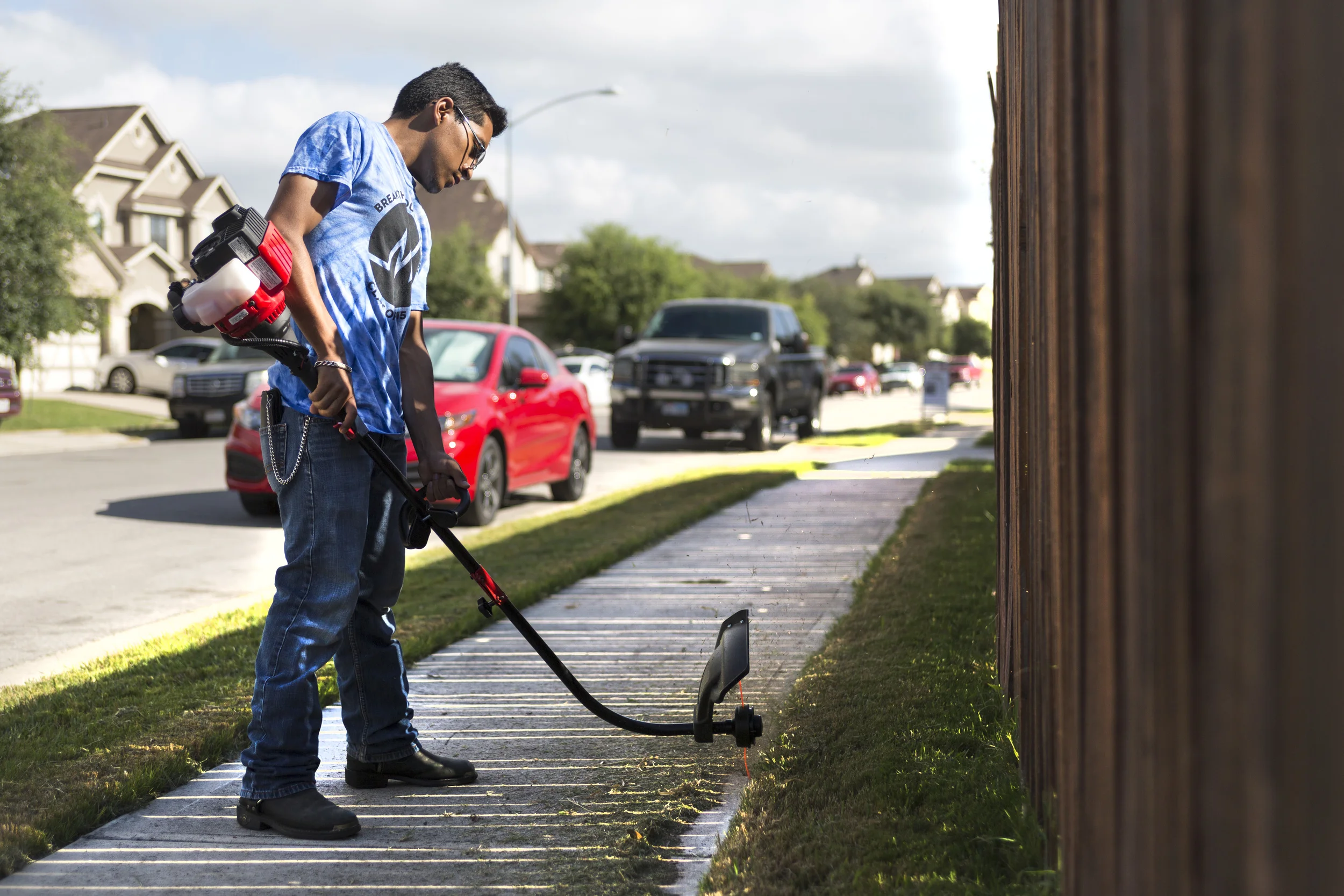 AUSTIN, TEXAS - July 25, 2015: Faced with high tuition, Joseph Ramirez started mowing lawns to offset his cost. Joseph plans on attending St. Edward's University during the fall. Miguel Gutierrez Jr./KUT News.